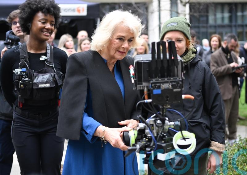 Queen tries her hand as camera assistant on crime drama as ITV marks anniversary