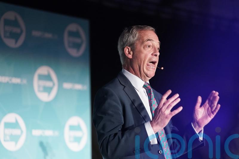 UK should ‘re-examine’ NHS funding model, says Farage ahead of Reform rally