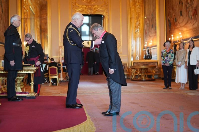 King returns to public duties with investiture ceremony at Windsor Castle