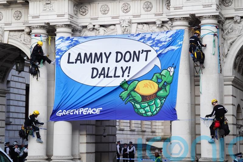 Four Greenpeace activists arrested after climbing Foreign Office building