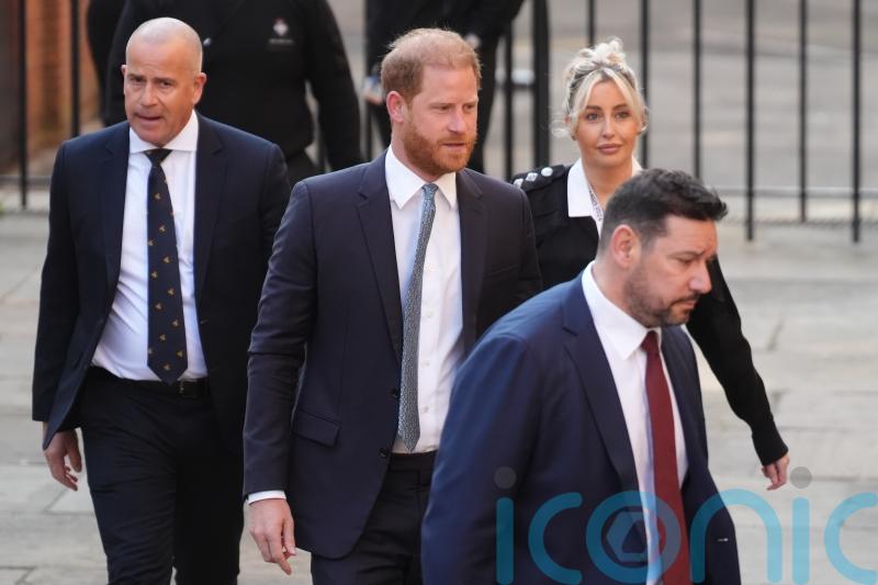 Harry and Meghan ‘felt forced to step back’ from royal family, court told