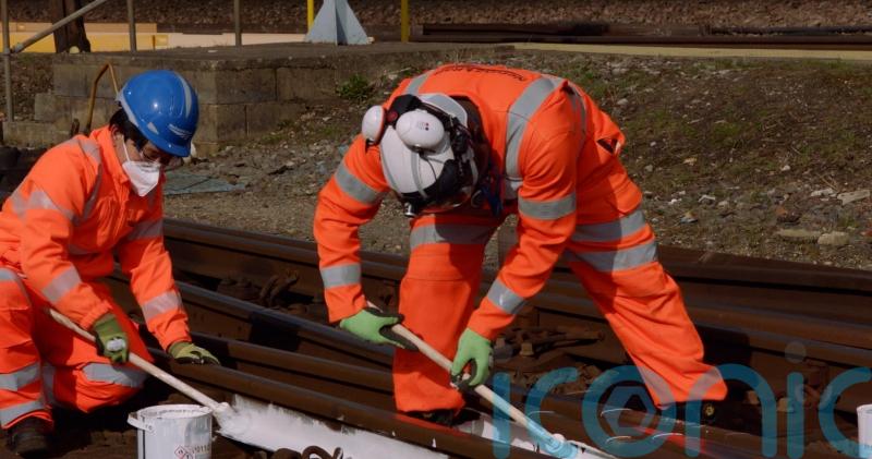 Rail tracks get paint job to keep trains moving this summer