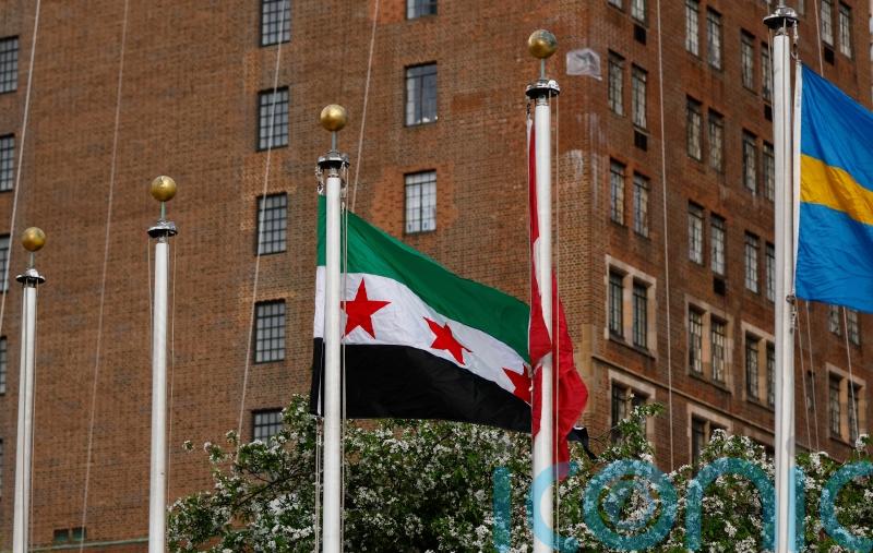 Syria’s foreign minister raises country’s new flag at UN headquarters