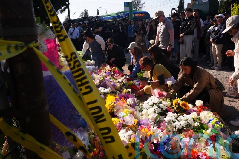 Vancouver attack suspect charged with murder as hundreds hold vigils for victims