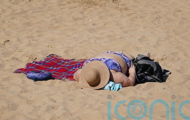 UK set for cooler than average bank holiday after record-breaking hot weather