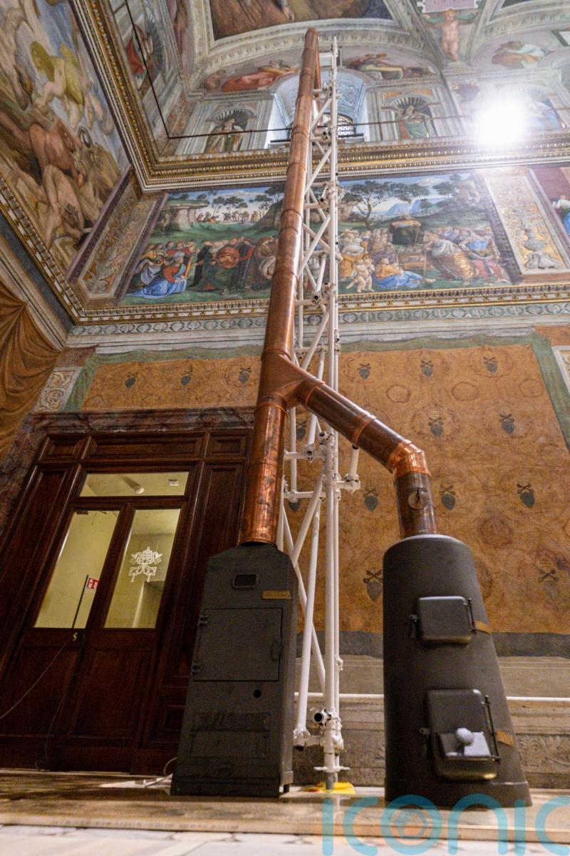 Vatican workers install Sistine Chapel stove ahead of conclave
