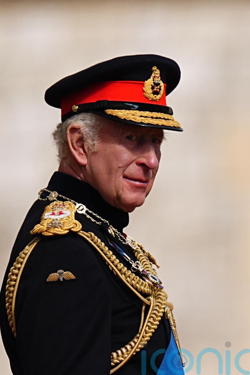 King speaks of ‘global uncertainty’ as he presents new standards to regiments