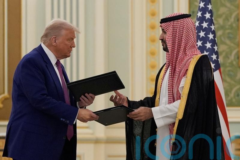 Trump and Saudi prince sign agreements as US leader begins Middle East tour
