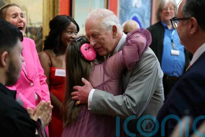 Teenager Florence surprises Charles with ‘awesome’ hug