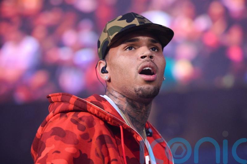 Singer Chris Brown to appear in court charged with grievous bodily harm