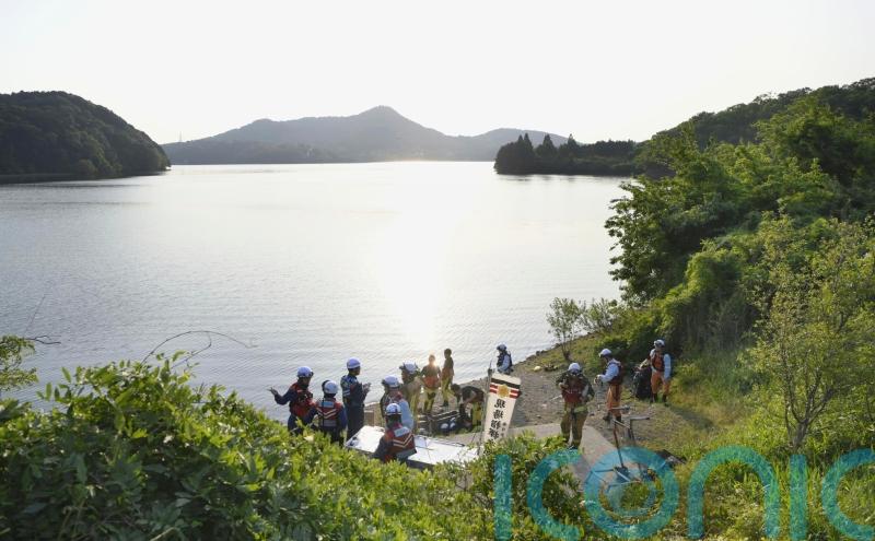 Japan retrieves body of one of two service members whose training plane crashed