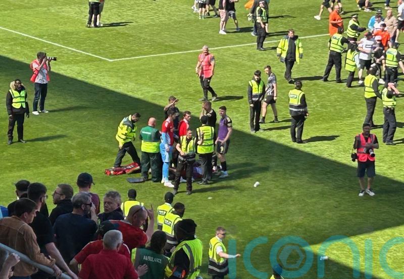Man in court after footballer hit by part of chair at match