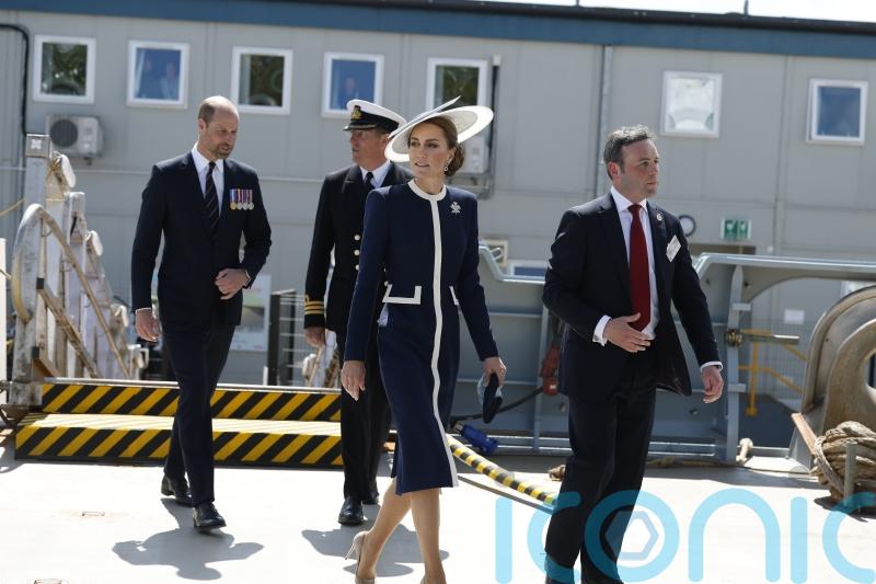 Kate names Royal Navy warship by smashing bottle of whisky against hull