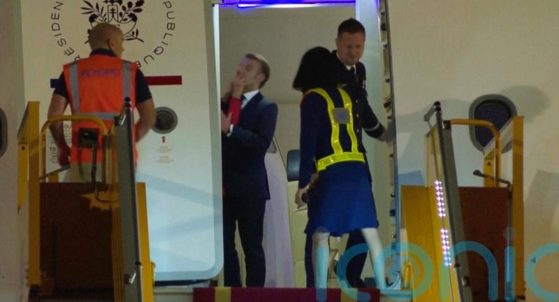 Macron cites horseplay as wife appears to push the French leader