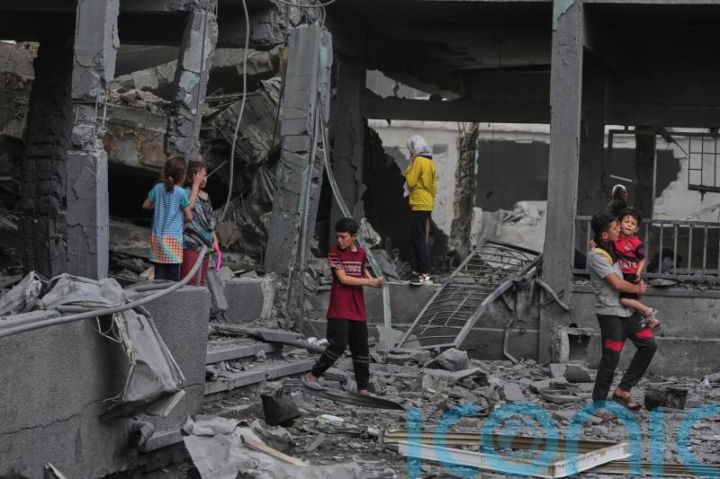 Israeli strike kills 14 Palestinians including women and children in Gaza camp