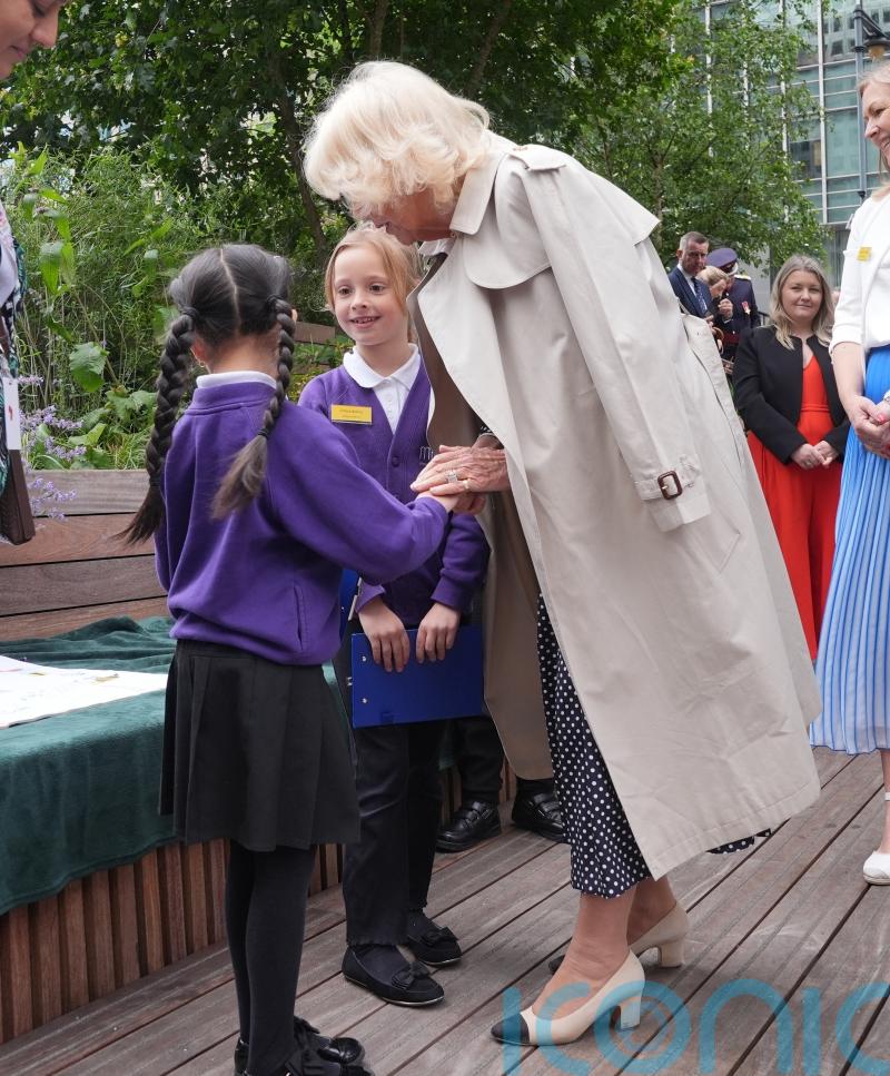Queen ‘warms up’ six-year-old girl’s ‘cold hands’ during blustery outdoor event