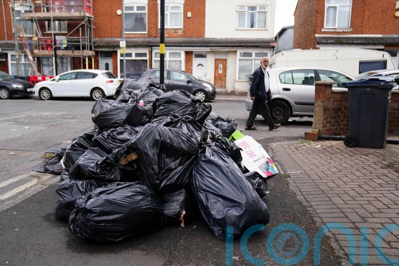 Bin workers in Birmingham vote to continue strikes over pay and jobs