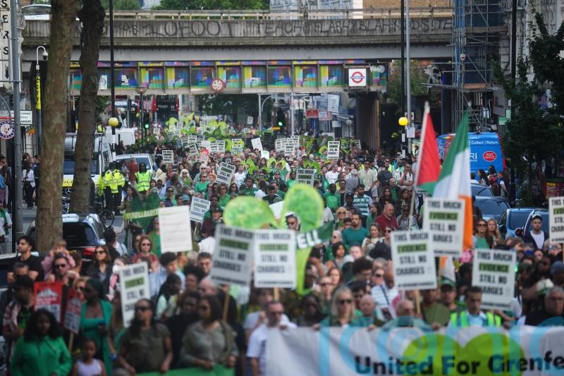 Shouts for justice at Grenfell anniversary march before tower demolition begins
