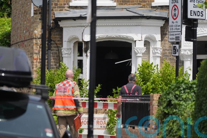 Charity worker found stabbed in house after gas explosion