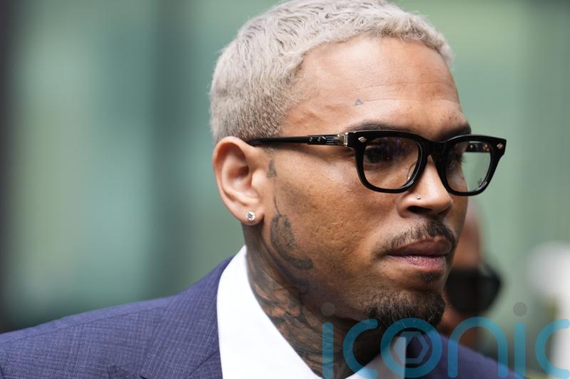 Chris Brown arrives at court to enter plea over ‘bottle attack’ charge