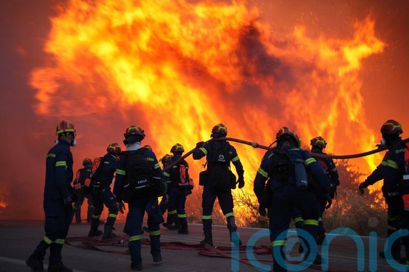 More than 100 firefighters battle large wildfire on Greek island