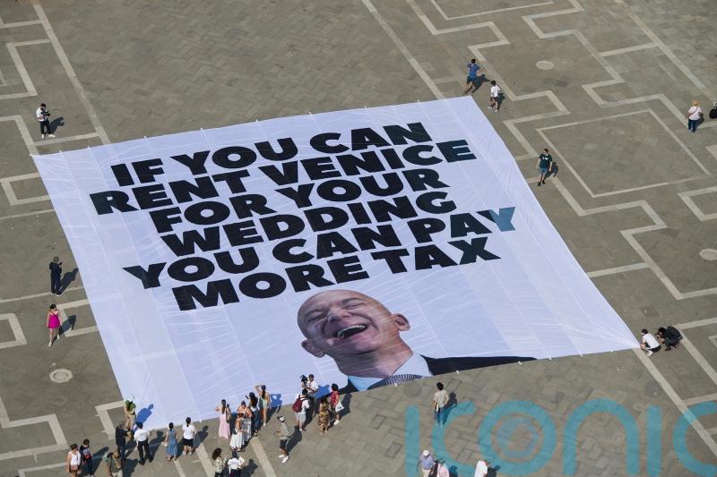 Bezos arrives in Venice as protesters say wedding highlights growing inequality
