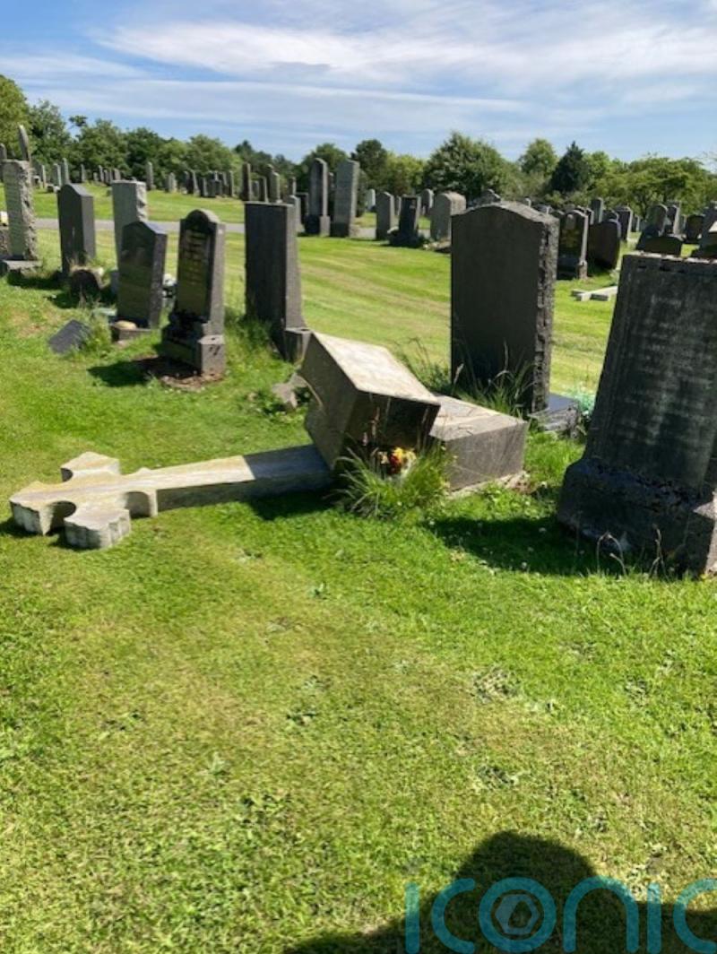 Crucifix set alight and headstones demolished in ‘senseless’ cemetery attack