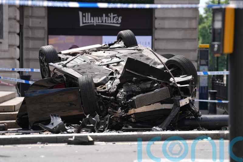 Young man fighting for life after BMW overturns in Piccadilly Circus