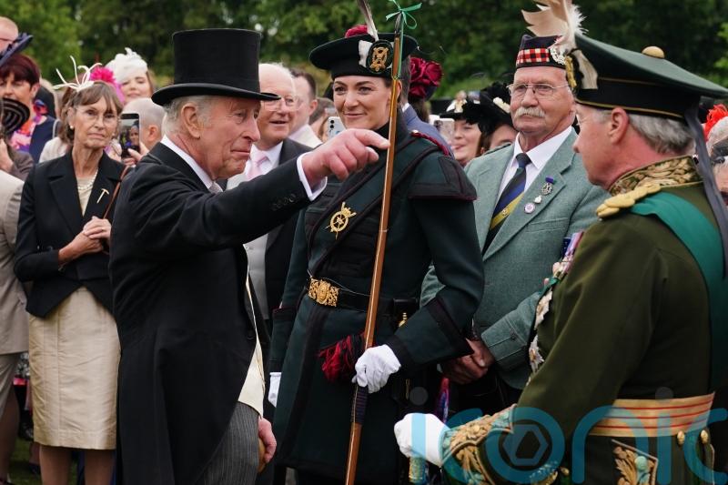 King and Queen begin Holyrood Week under guard of ceremonial female bodyguards