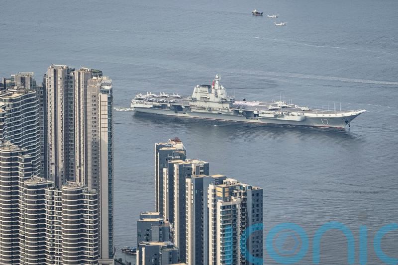 Chinese aircraft carrier sails into Hong Kong to boost patriotism