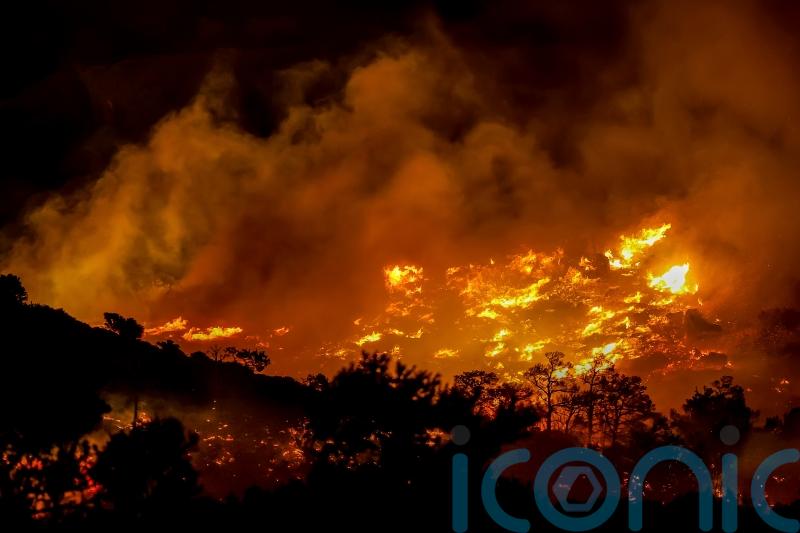 Firefighters race to contain wildfires in Greece as thousands evacuated