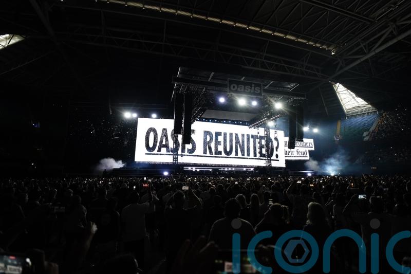 Oasis take to stage for first gig in 16 years to jumping crowd and flying cups