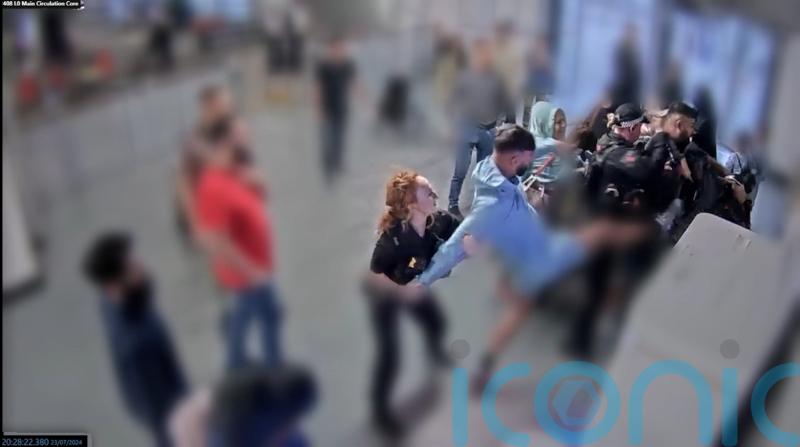 Jury shown CCTV footage of alleged assault on police at Manchester Airport