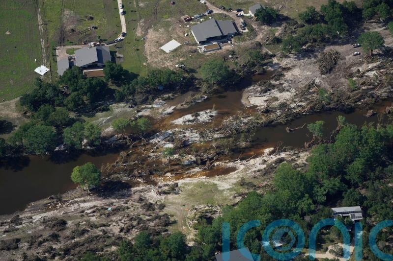 Searchers in helicopters and on horseback scour Texas flood debris for missing