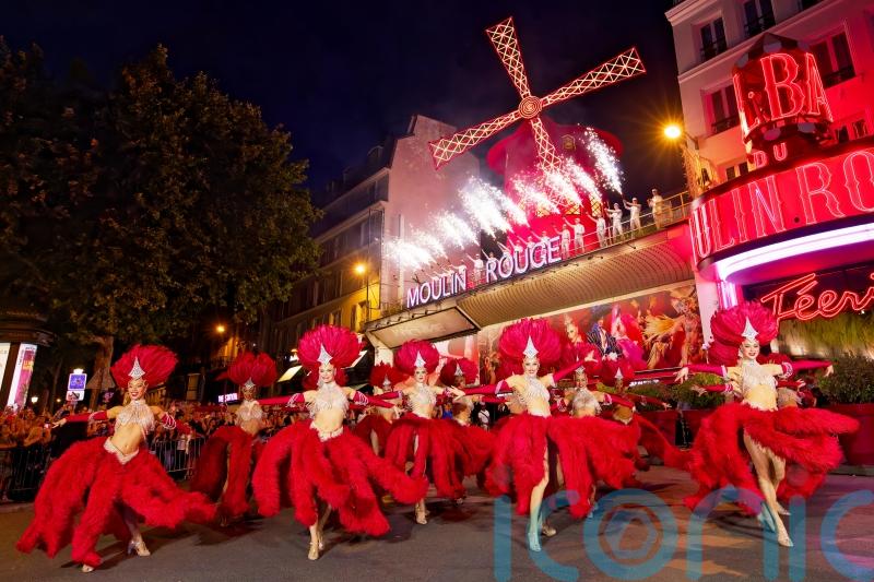 Moulin Rouge’s windmill sails turn again after restoration