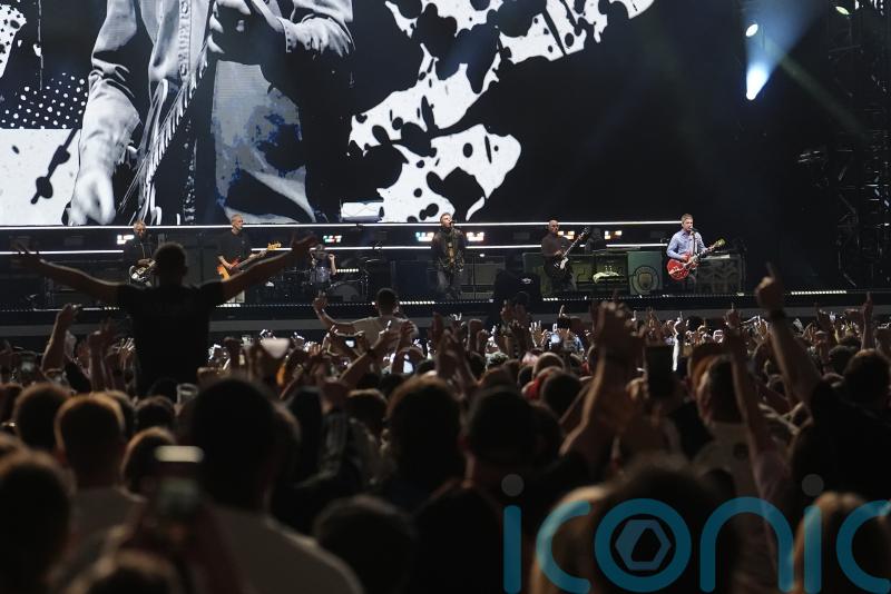 Fences erected at Oasis’s Manchester gig site as ticketless fans urged not to go