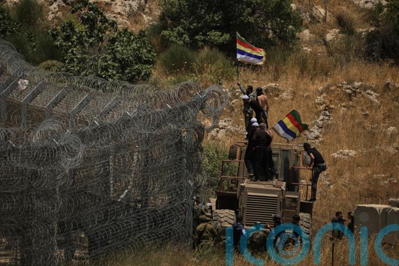Clashes rage in Syrian city as Israel launches strike on Damascus