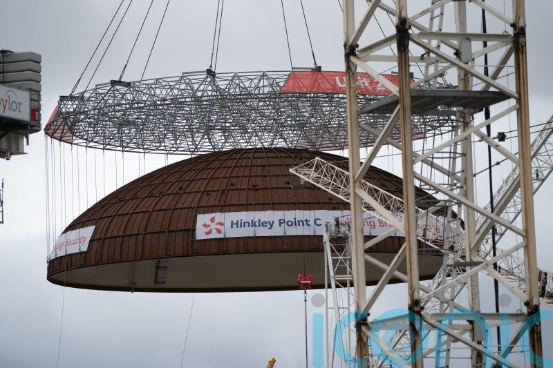 World’s largest crane ‘Big Carl’ lifts reactor dome into place at Hinkley Point C