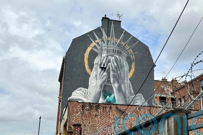 French mural shows Statue of Liberty covering her eyes in swipe at Trump