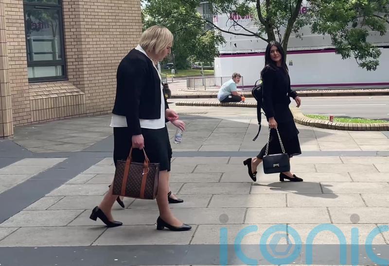 Former Tory MP appears in court charged with having false passport