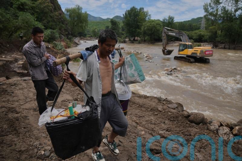 Dozens dead after flooding and landslides near Beijing
