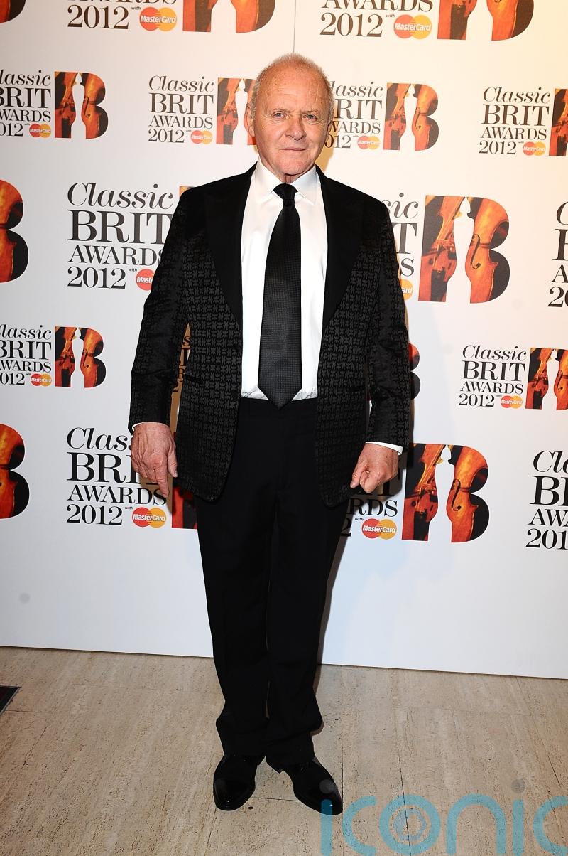 Anthony Hopkins channels Hannibal Lecter while wearing Skims face wrap