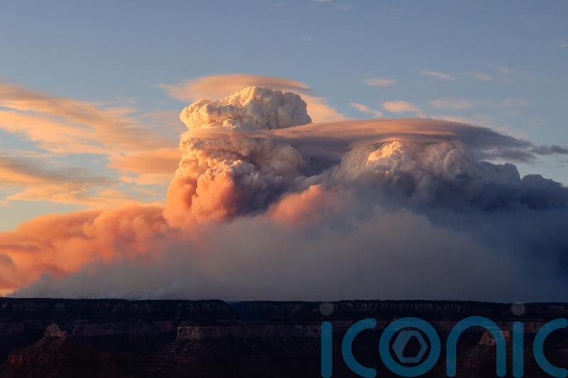Wildfires creating ‘fire clouds’ that are further fanning blazes, officials warn