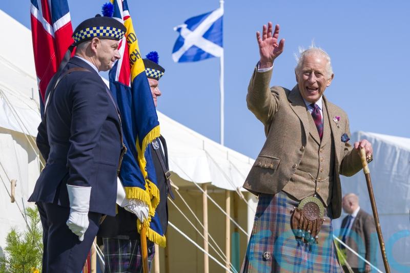King enjoys dram of whisky at Highland Games
