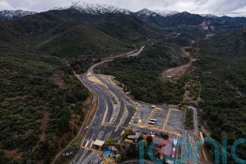 Rescue workers find body amid race to save people trapped in Chile copper mine