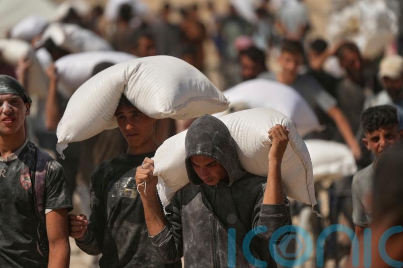 At least 27 people seeking food killed by Israeli gunfire, health officials say