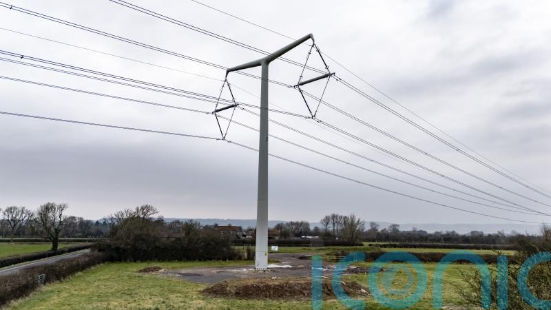 Households living near new pylons could get £250 a year off bills for a decade