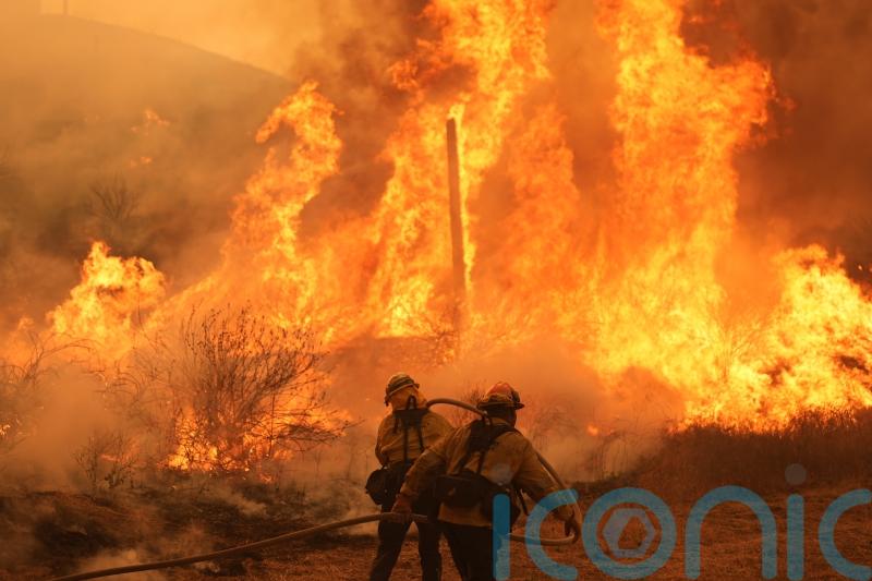 Fast-growing brush fire forces thousands to evacuate area north of Los Angeles