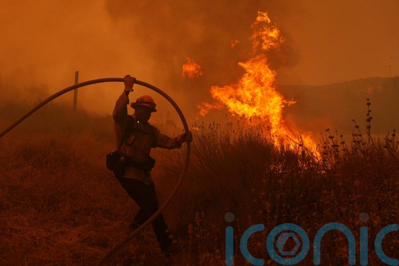Fire crews make progress against blaze that forced thousands to flee north of LA