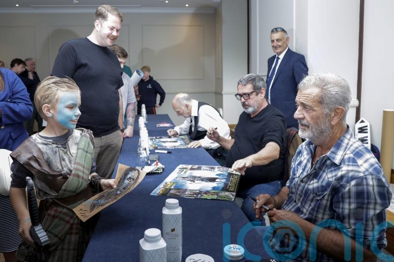 Mel Gibson poses for selfies with fans to mark 30 years of Braveheart film
